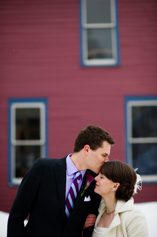 groom kissing the bride's head - photo by Denver based wedding photographers Adam and Imthiaz